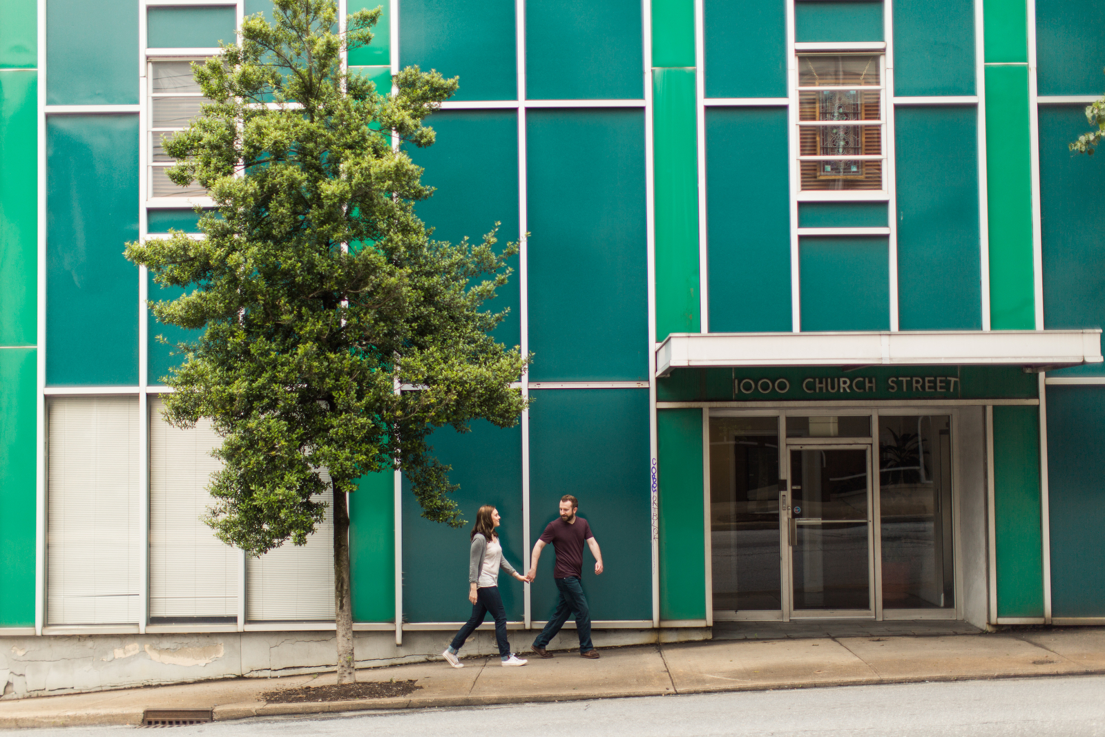 funky teal building engagement photos