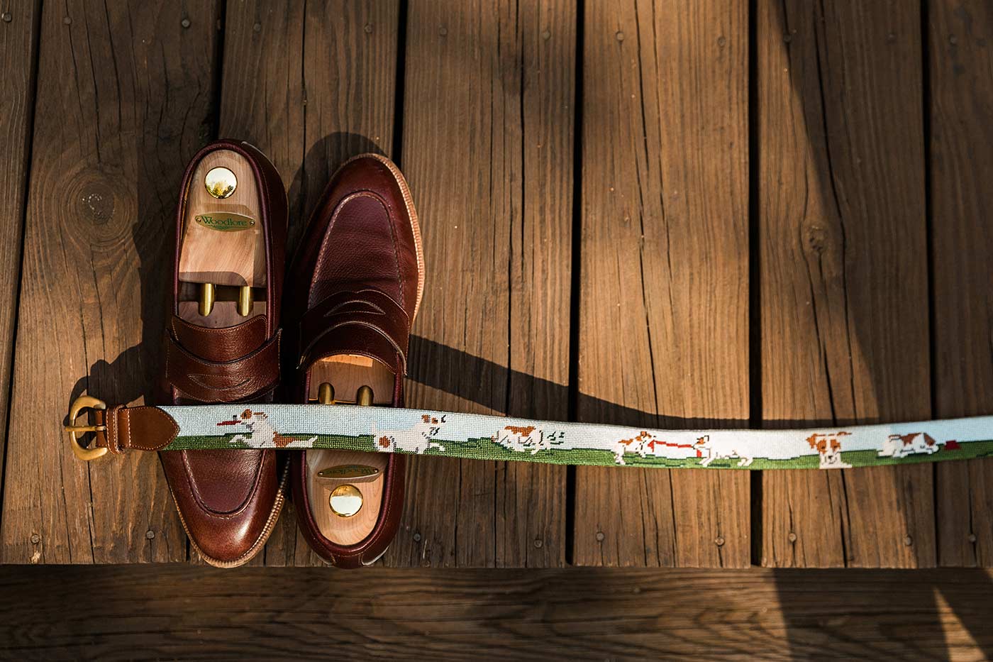 groom's brown leather shoes with dog belt