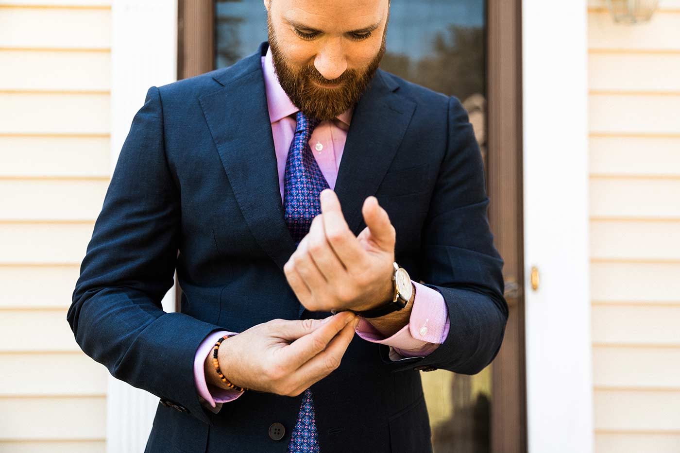 groom putting on watch