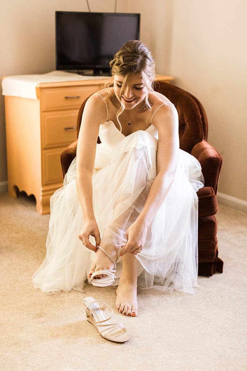 bride putting on shoes