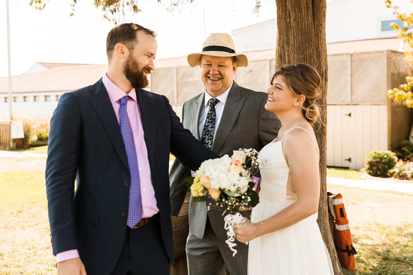 father handing off bride to groom