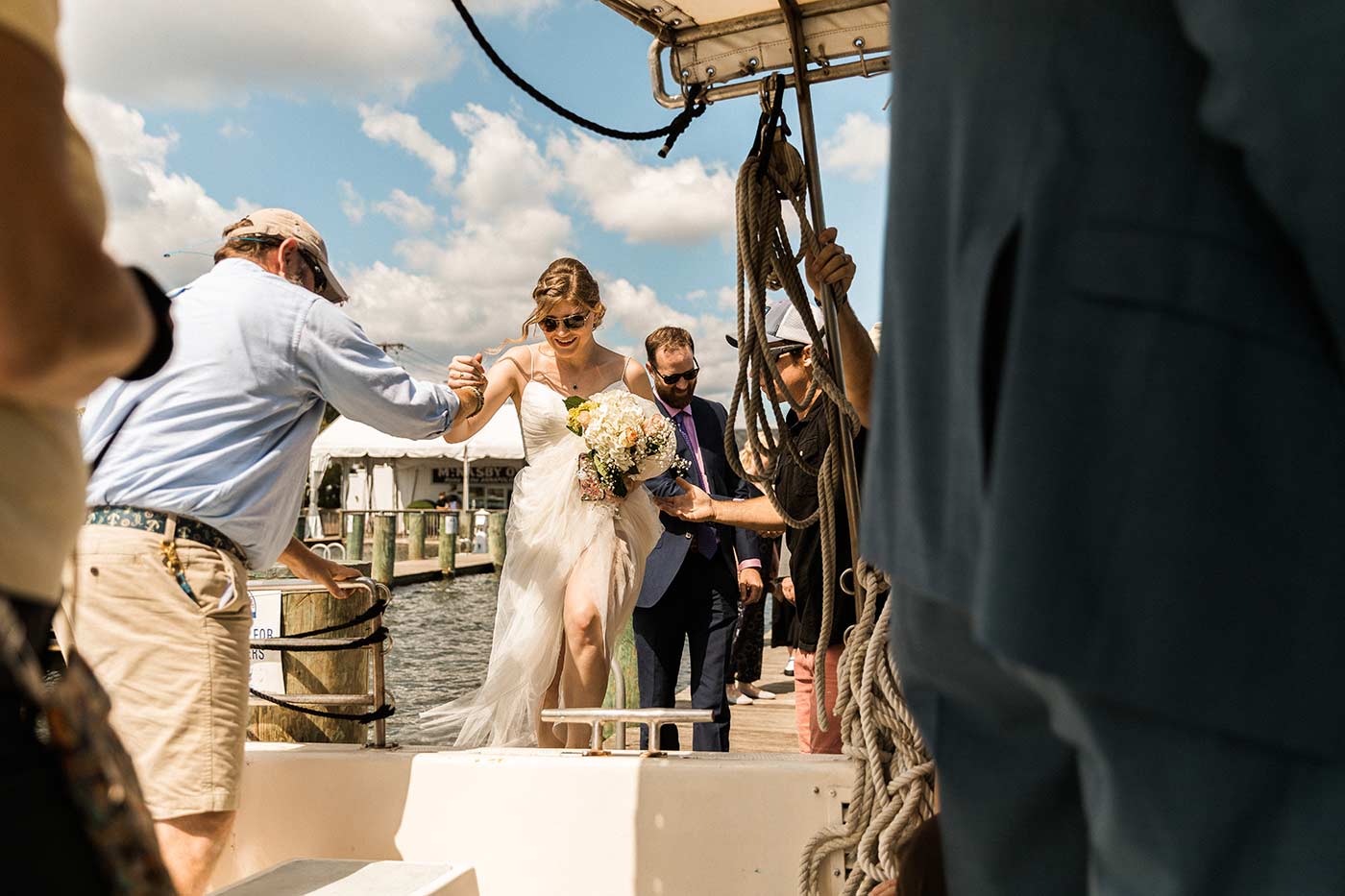bride and groom boarding a boat