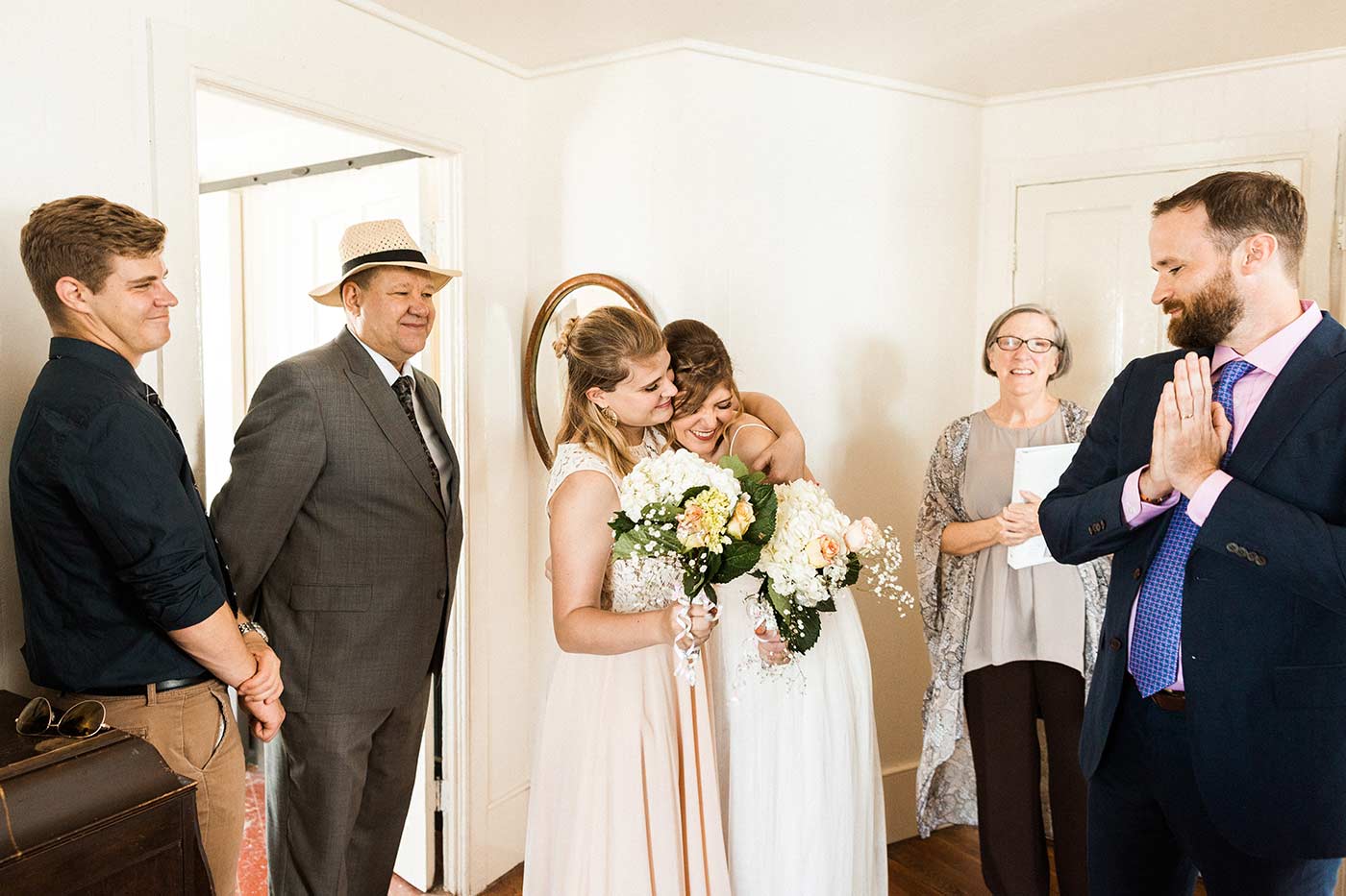 bride hugging sister