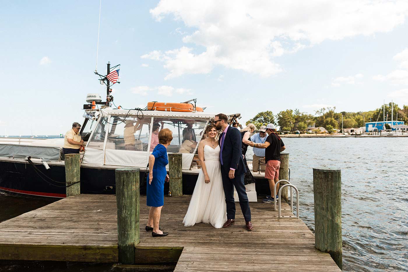 bride and groom on boat pier