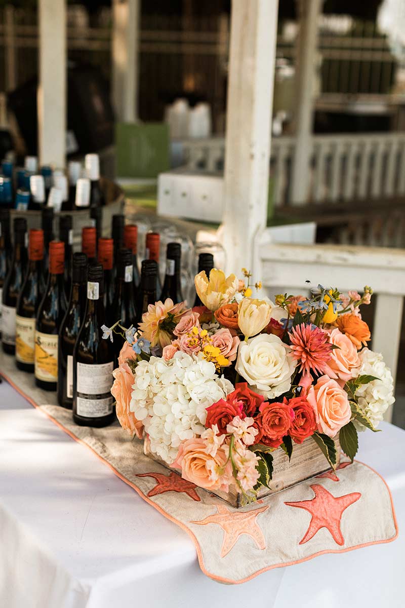 Wine bottles and floral arrangements