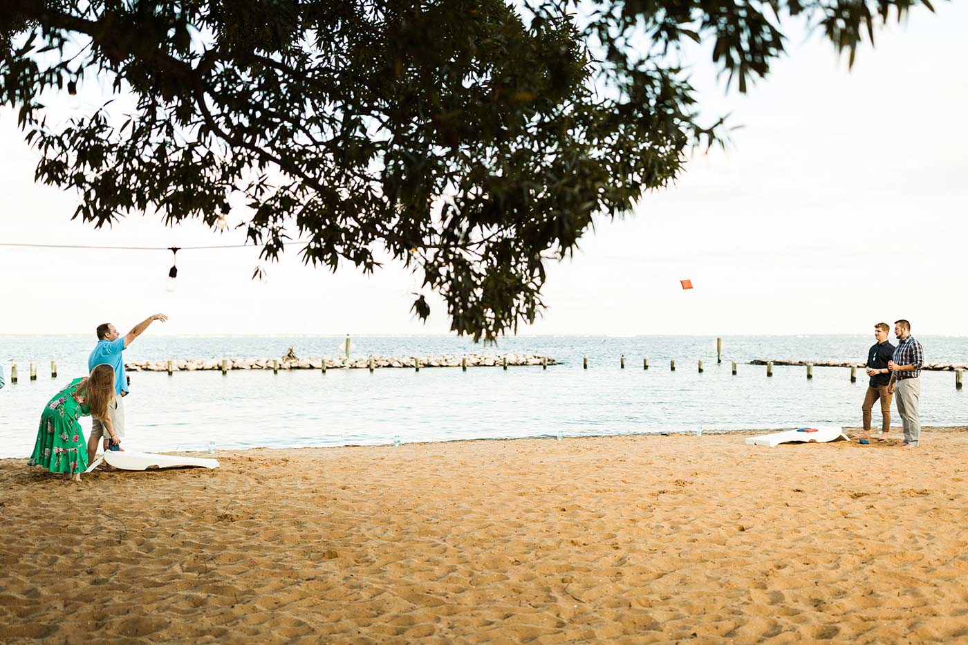 beach cornhole at oyster harbor beach