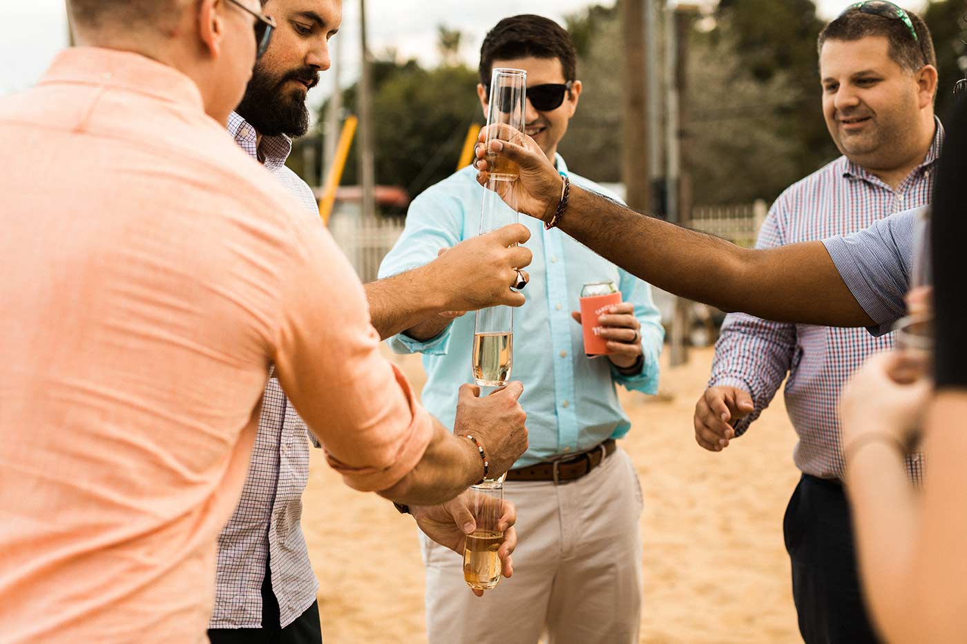 wedding guests stacking champagne cups