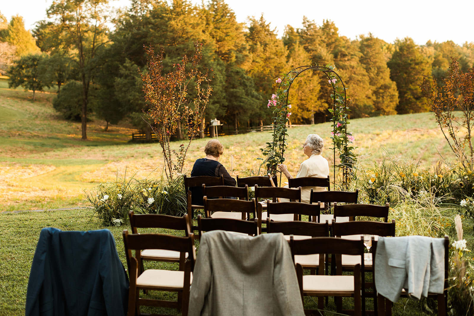 Grandmothers sitting in wedding ceremony space talking