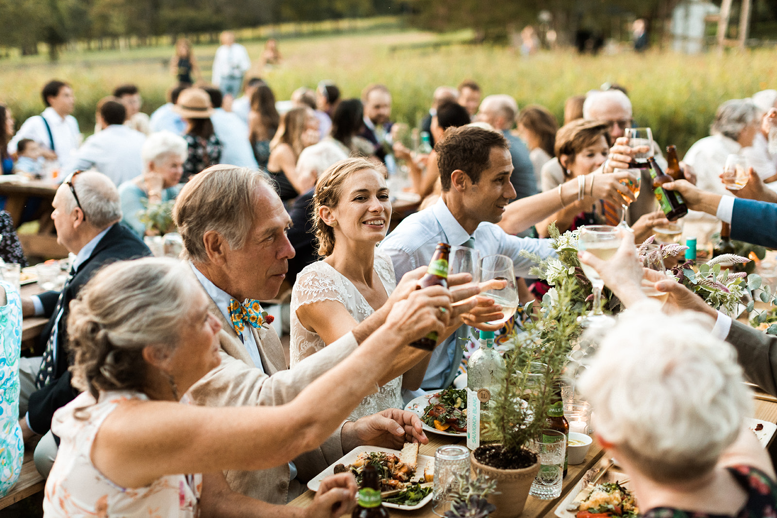 wedding guests toasting during dinner