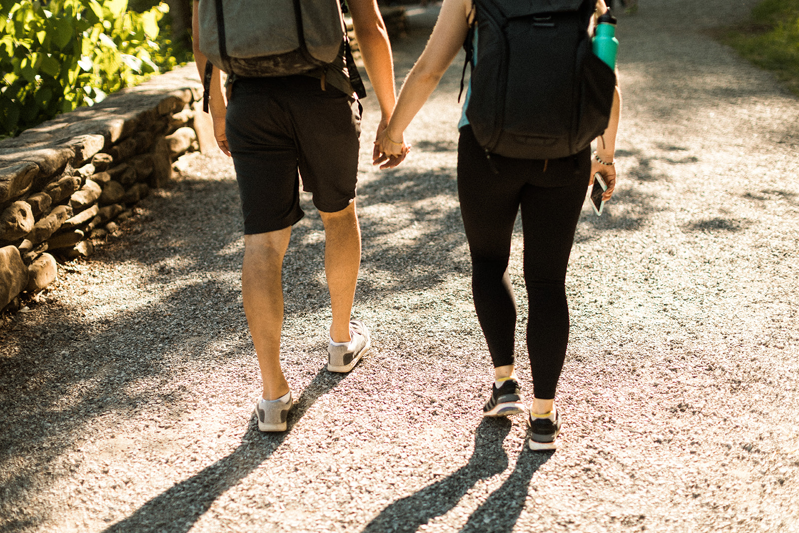 couple hiking and holding hands