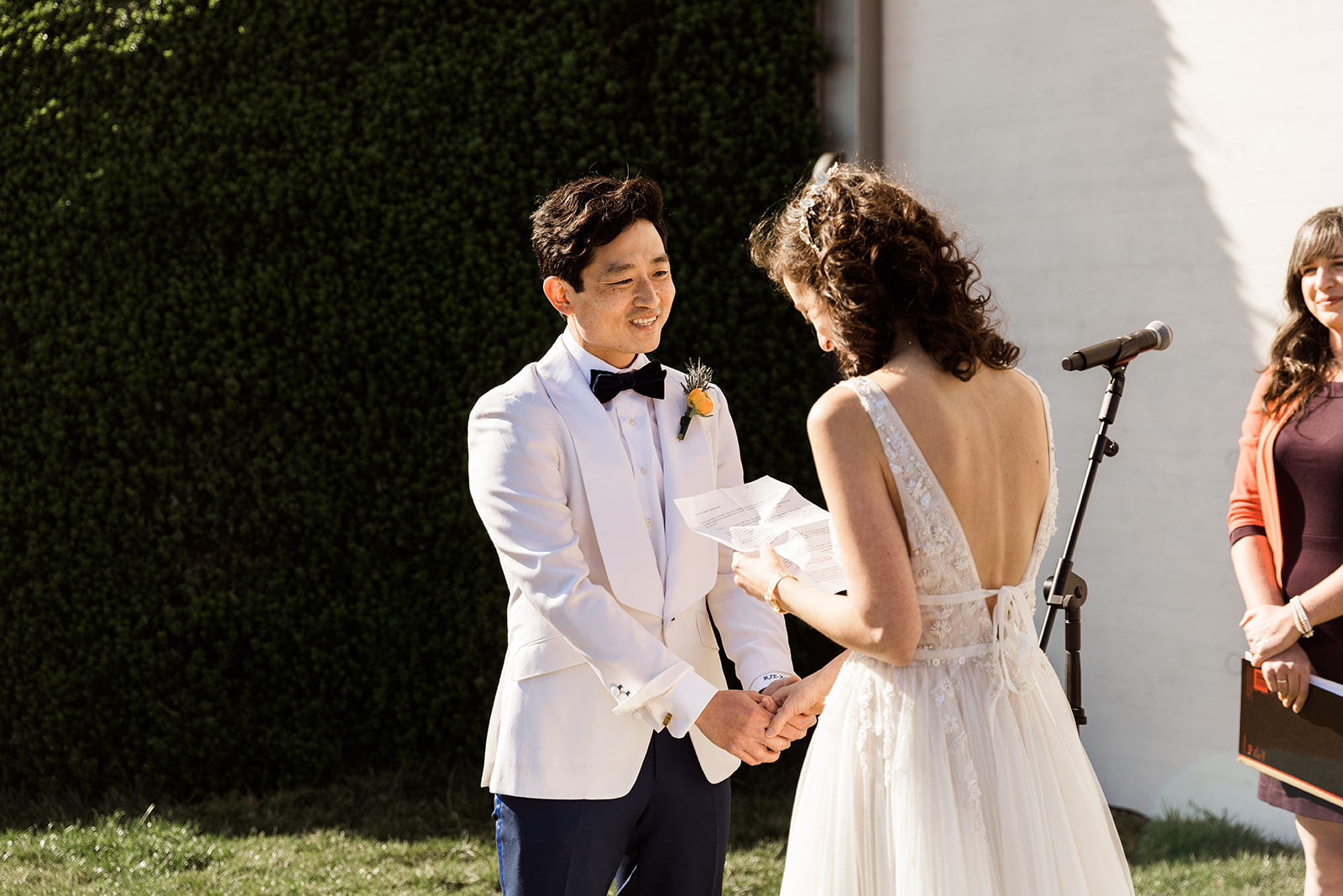 bride reading wedding vows