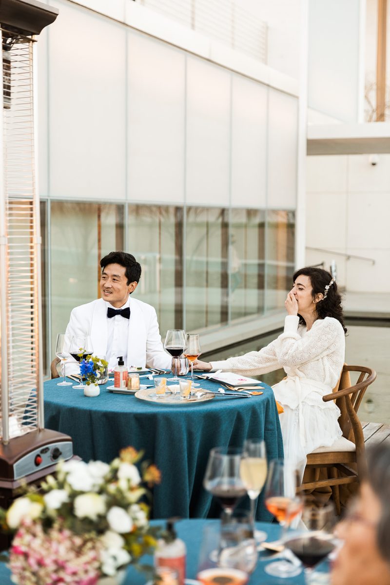 bride laughing during speeches