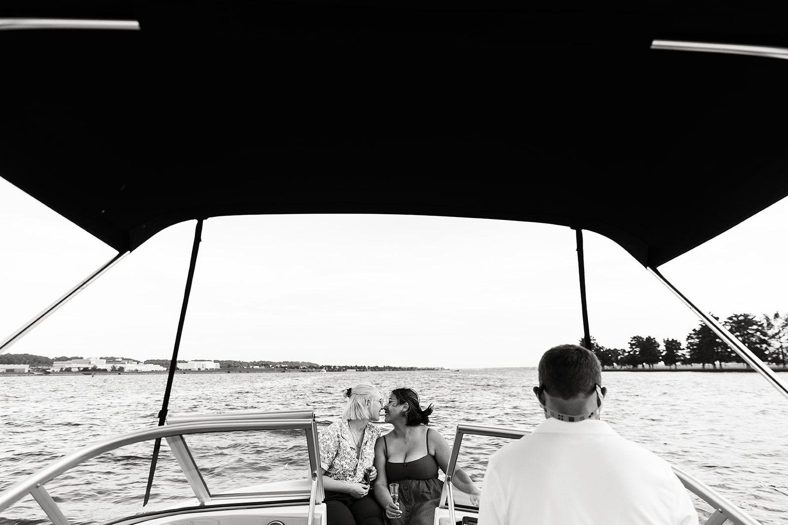 two women kissing on a boat on the potomac river