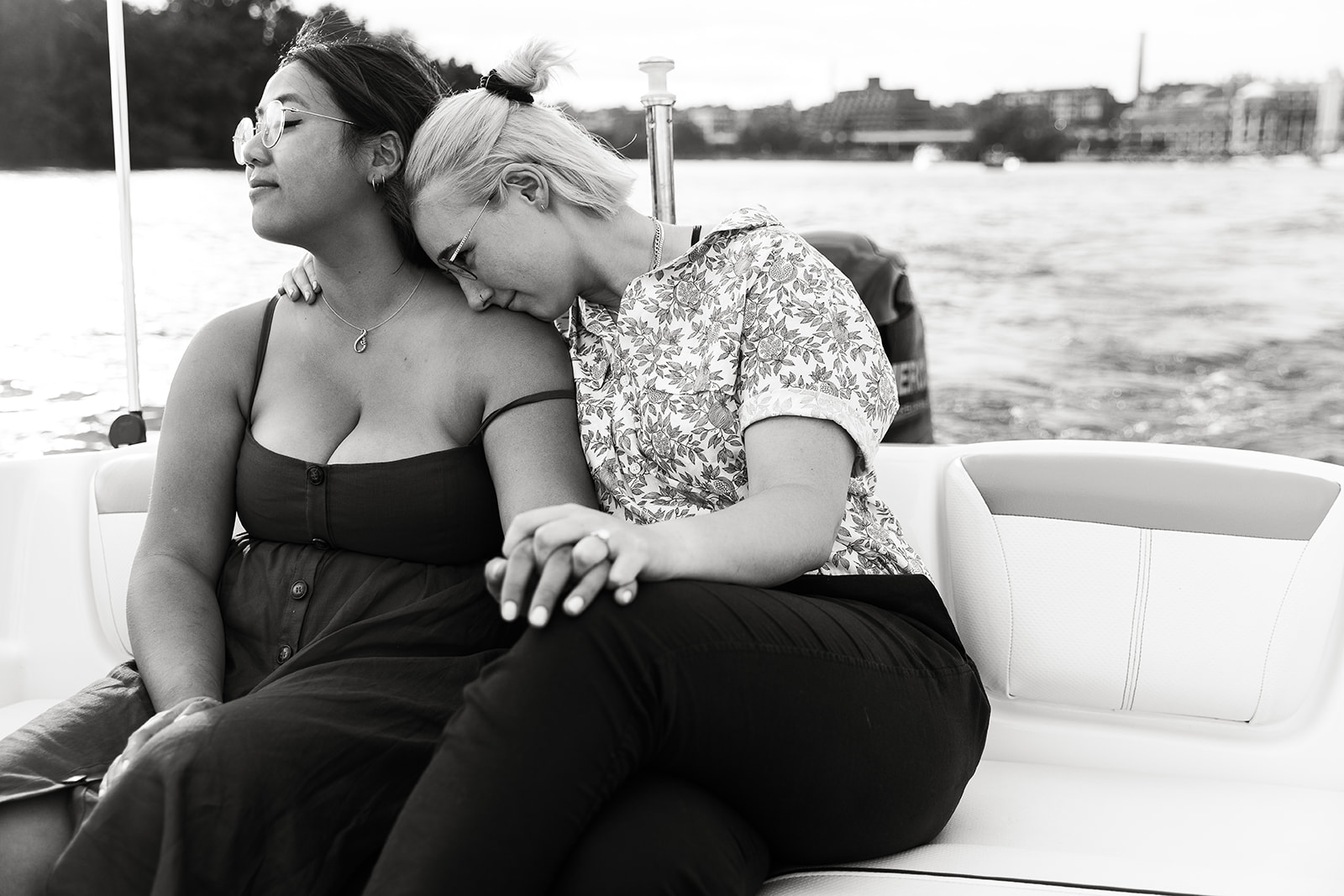 women snuggling on a boat in washington dc