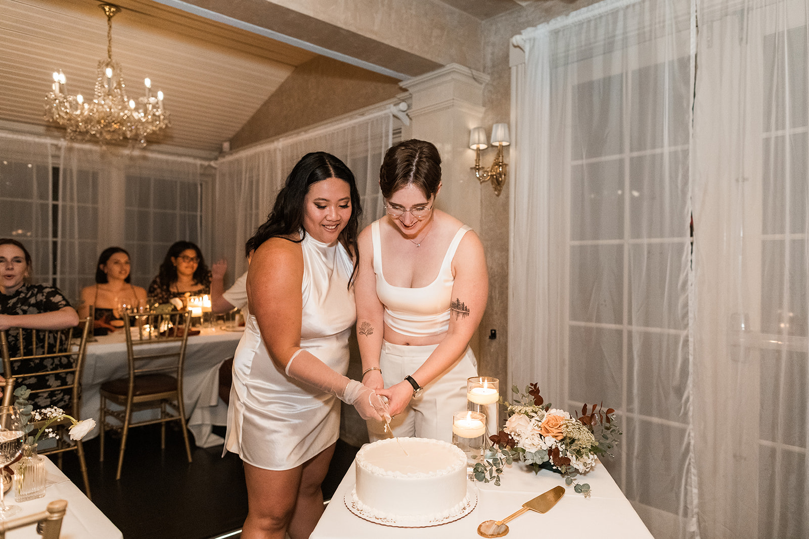 lgbtq+ couple cake cutting wedding
