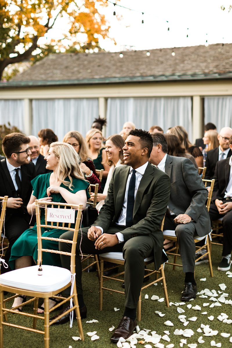 wedding guest laughing