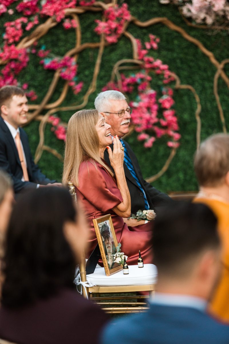 wedding guest laughing