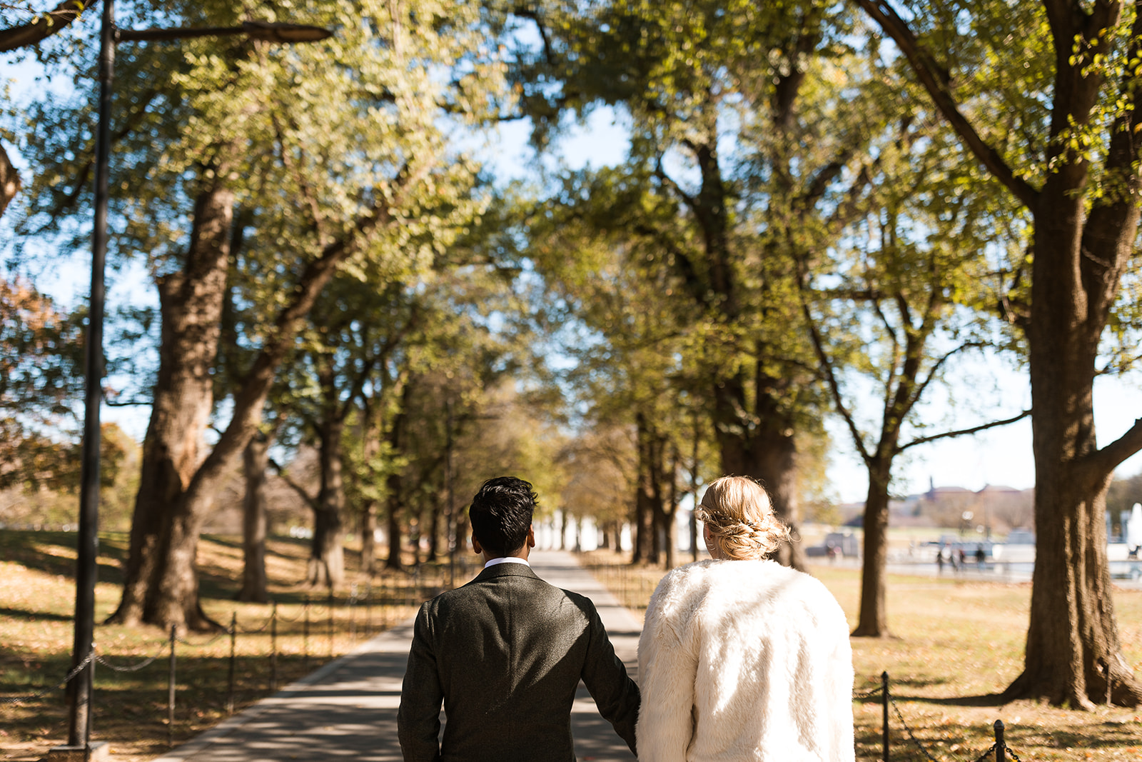 bride and groom walking through dc mall