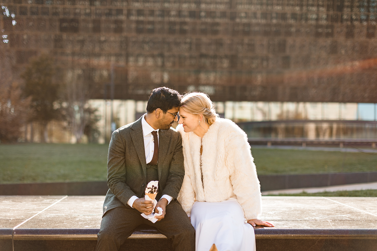 bride and groom eating ice cream