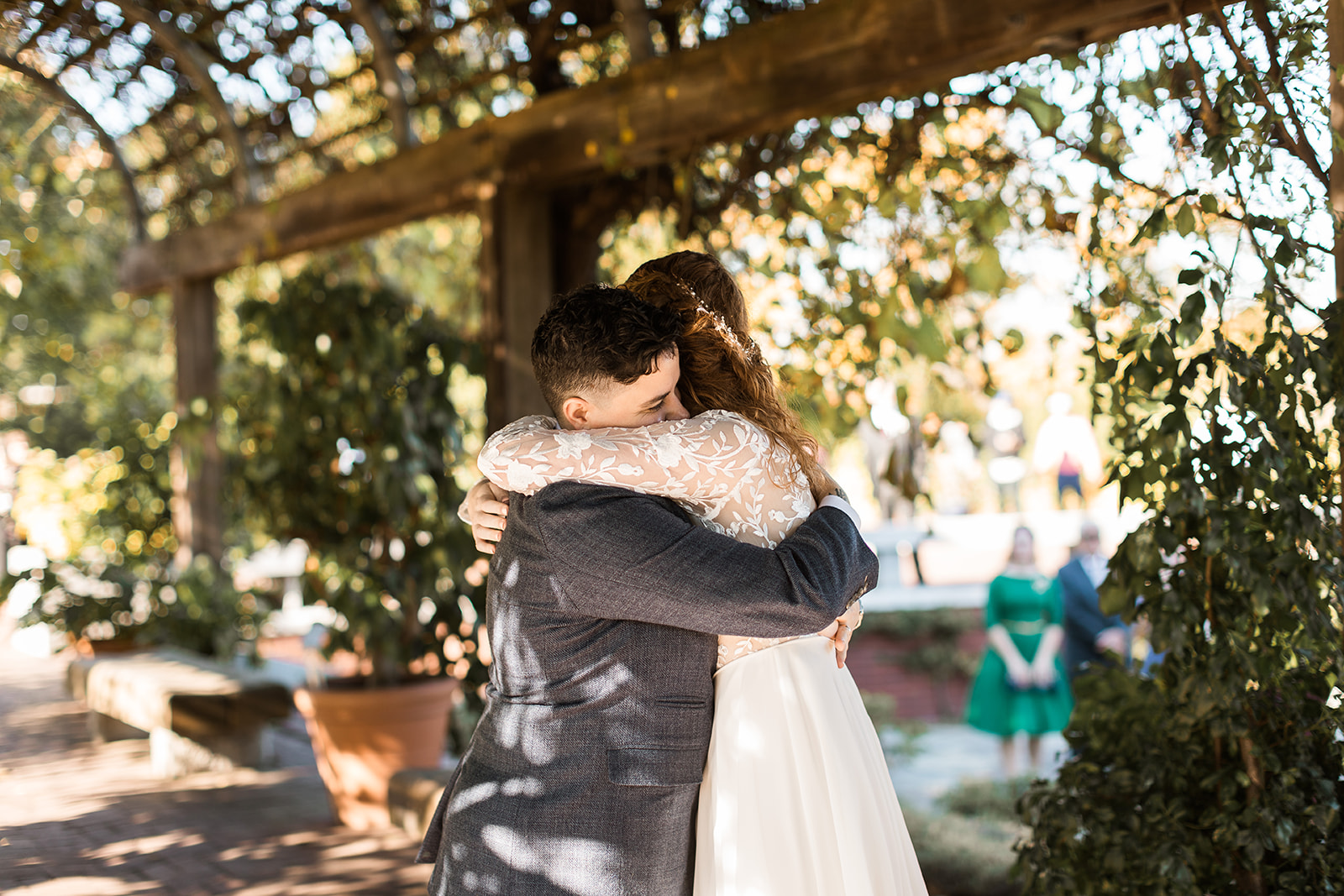 LGBTQ couple hugging on their wedding day at National Arboretum in Washington DC. 