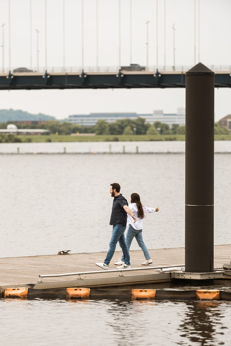 couple walking out on dock in dc