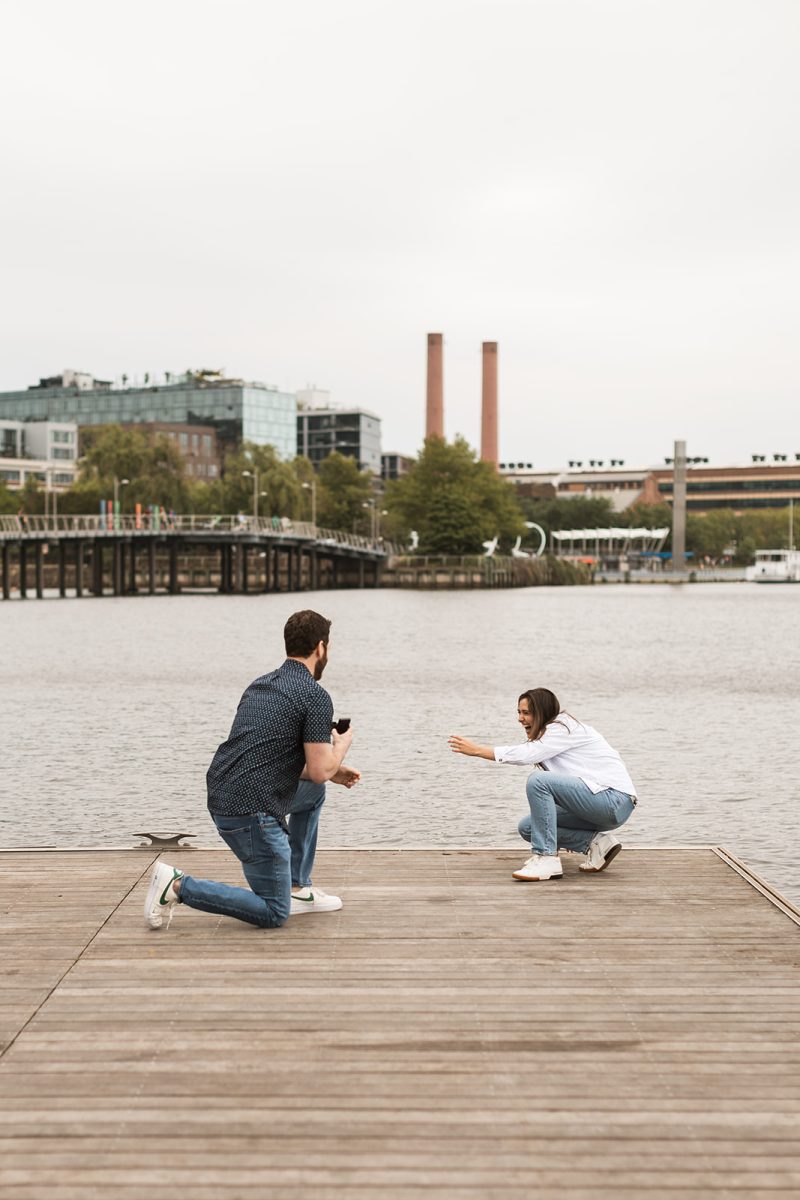 man proposing to woman on dock in dc