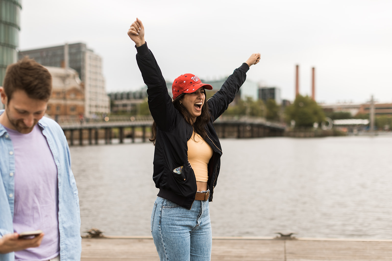 woman wearing capitols hat cheering