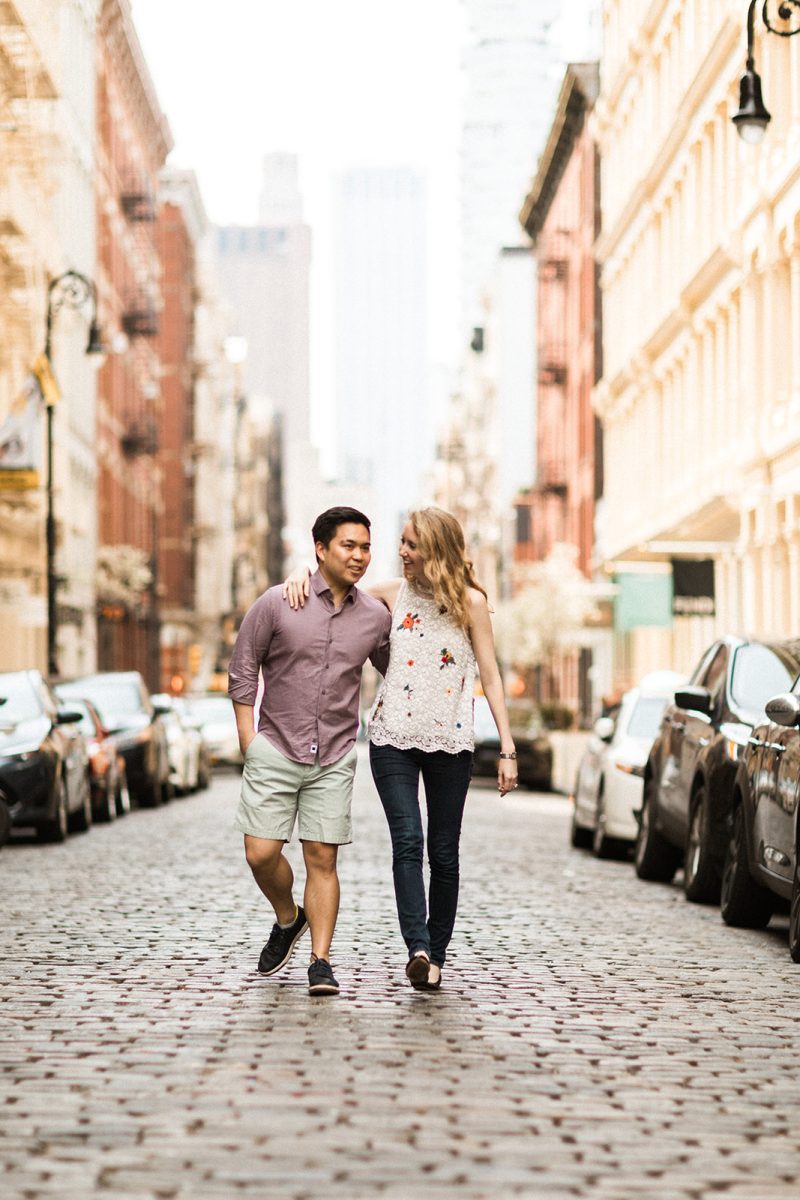 man and woman walking in street in NYC 