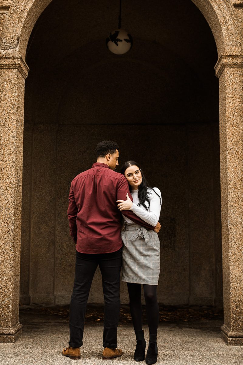 man and woman standing under arch in meridian hill park dc 