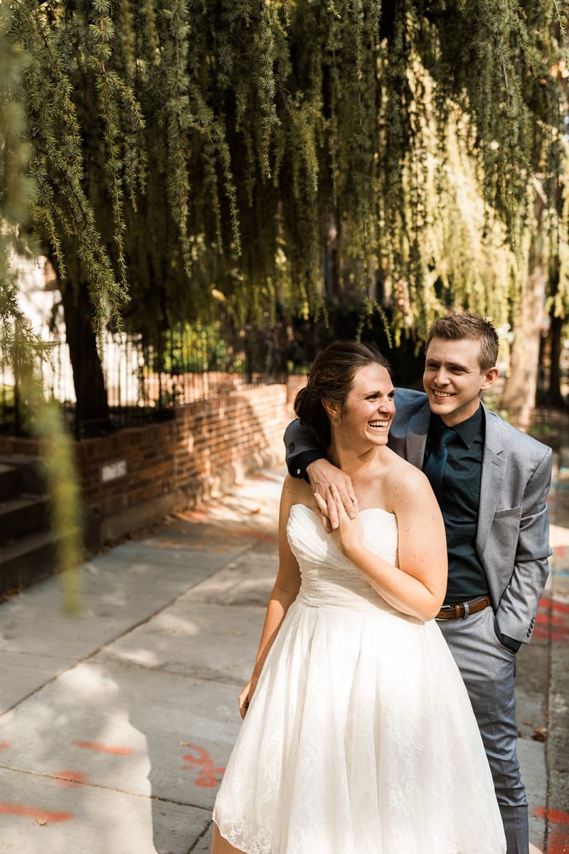 bride and groom laughing 
