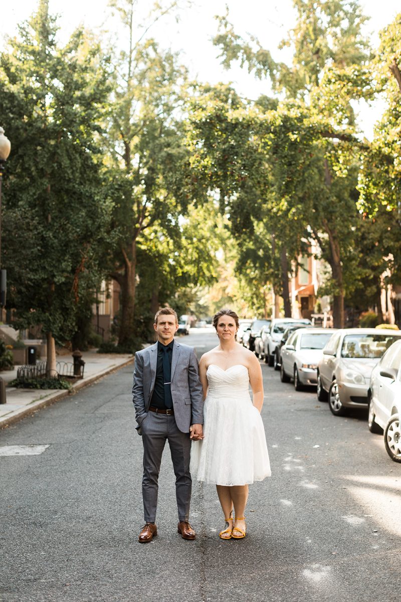 bride and groom posing in middle of street in washington dc 