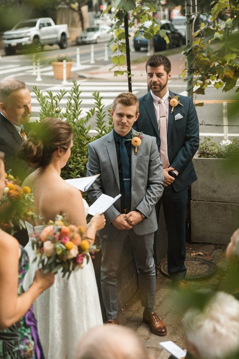 bride reading vows during outdoor wedding ceremony