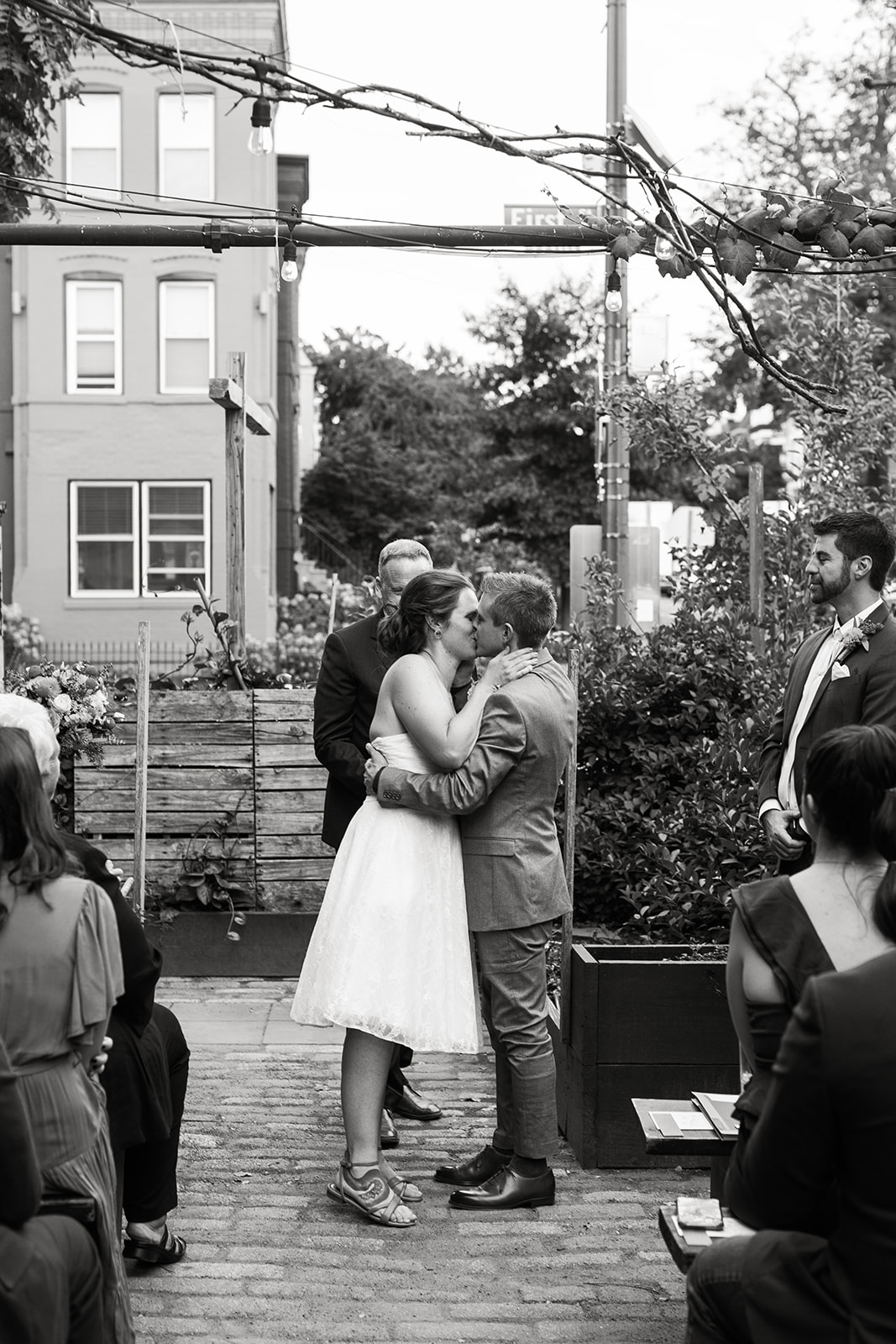 bride and groom first kiss during wedding ceremony at big bear cafe 