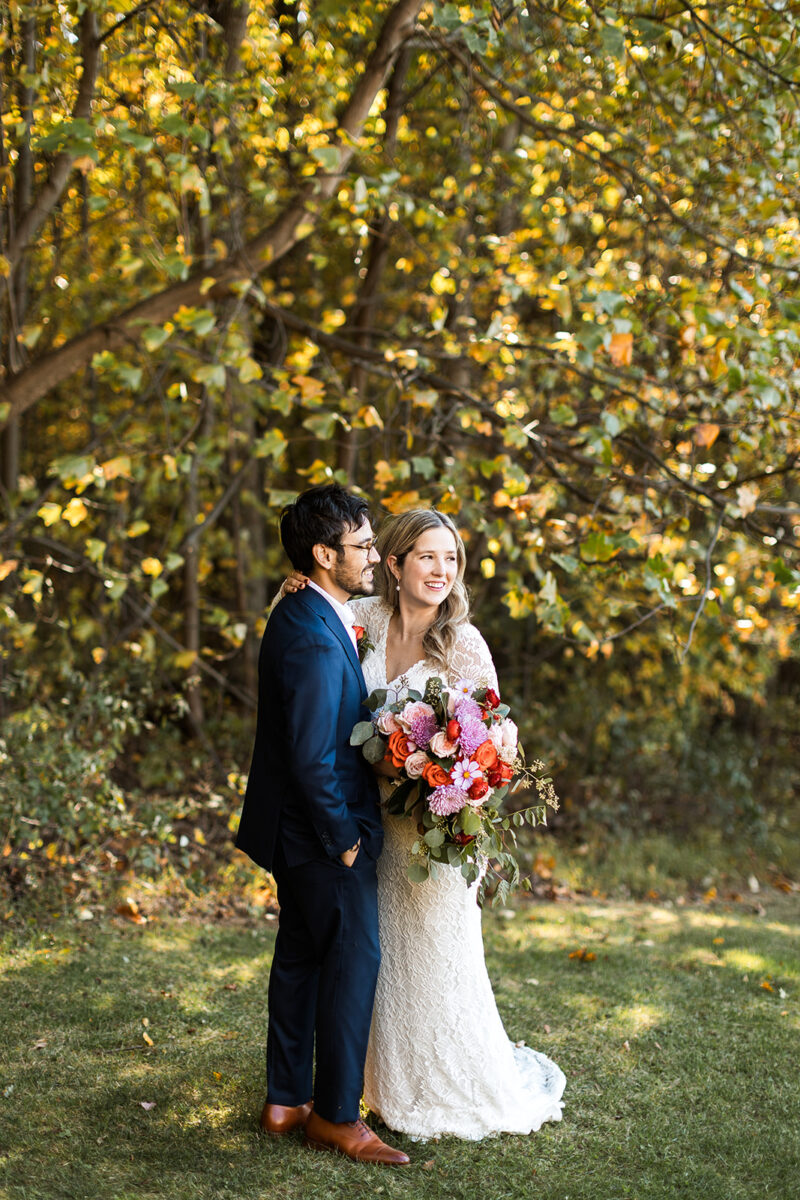 bride and groom portraits surrounded by lush fall forest landscapes in shenandoah