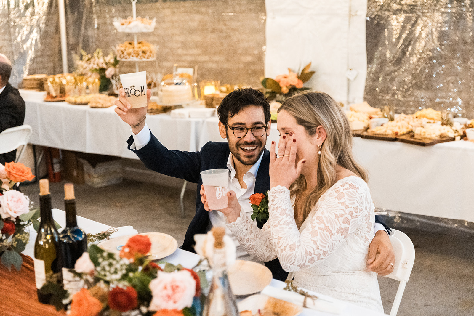 candid bride and groom moments celebrating during their wedding reception