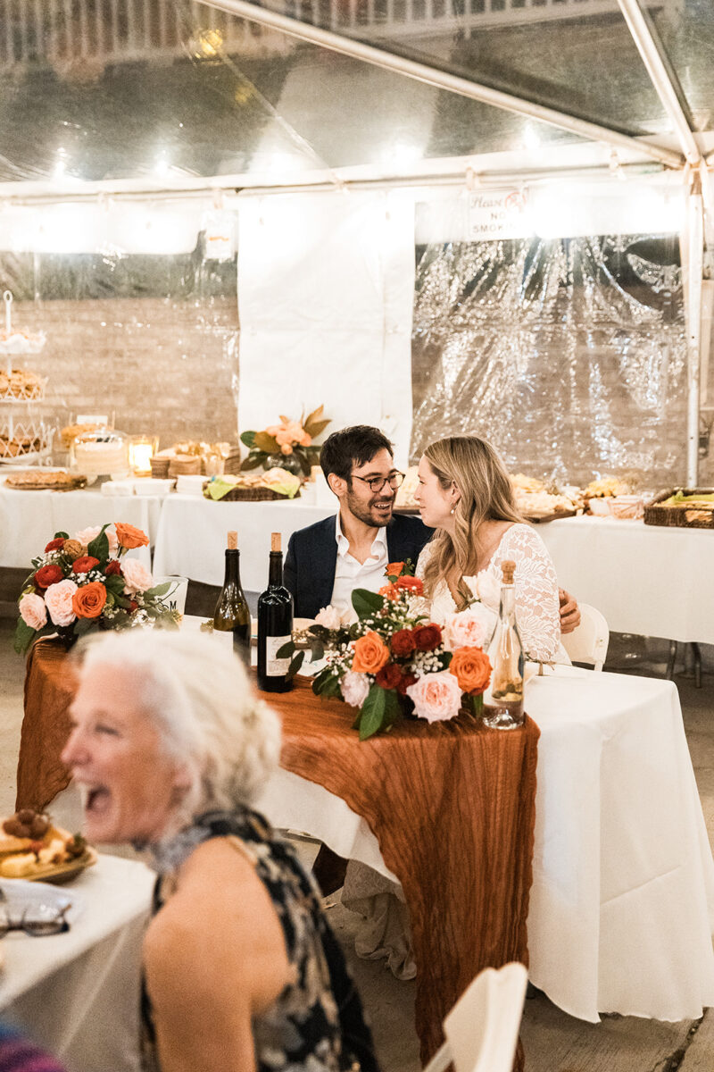 candid bride and groom moments celebrating during their wedding reception