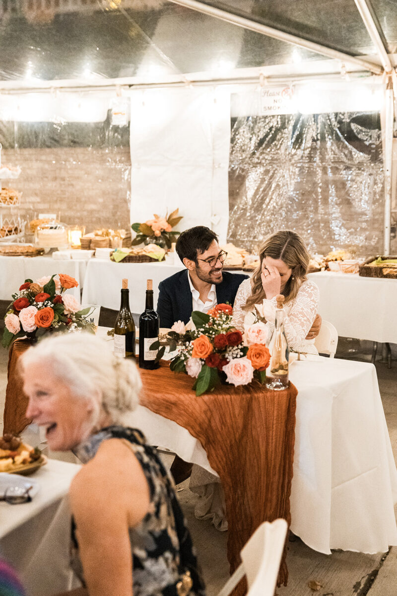 candid bride and groom moments celebrating during their wedding reception