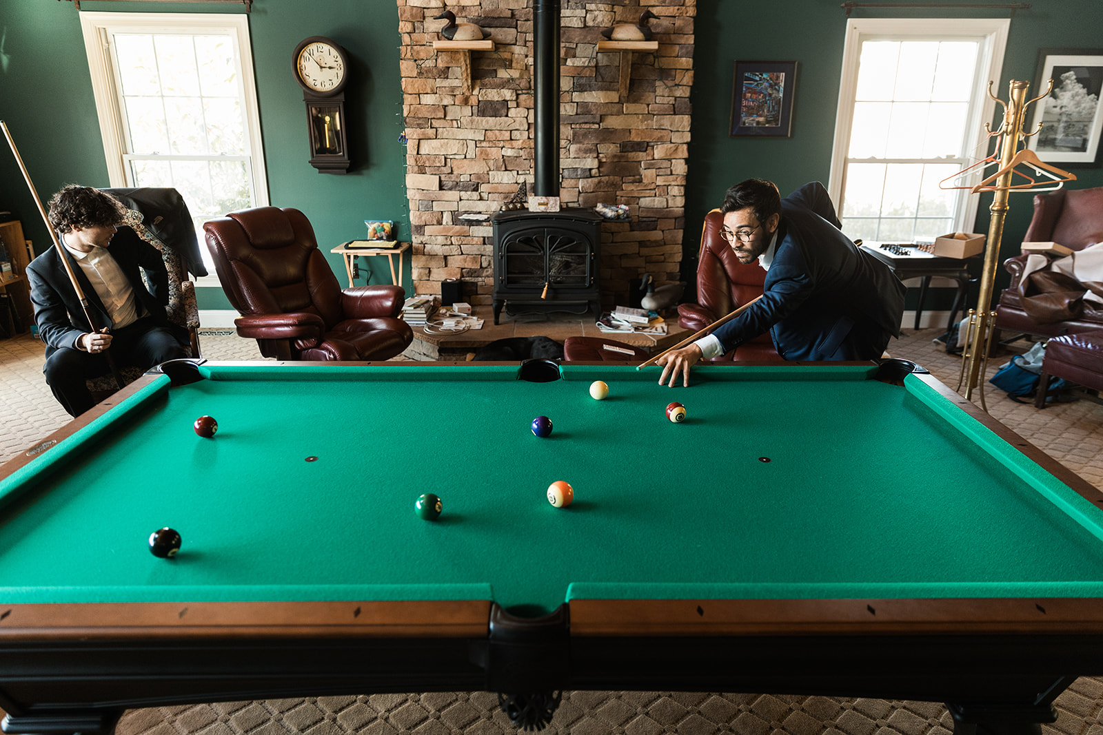 groom playing pool