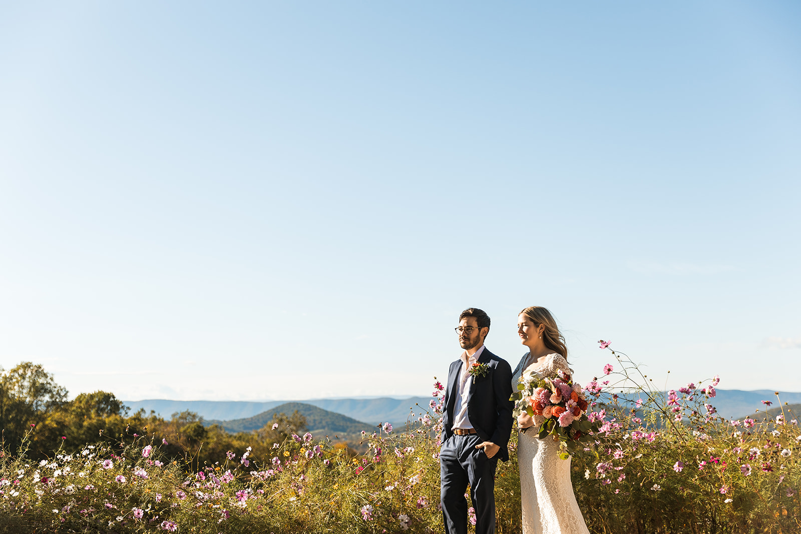 bride and groom portraits with shenandoah mountains in the backdrop