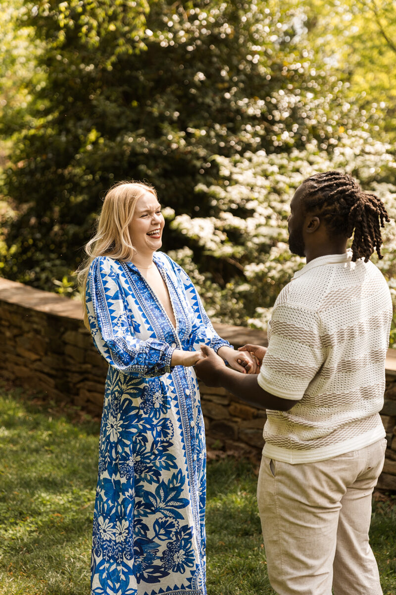candid garden proposal moments at bishop's garden in front of the national cathedral in dc