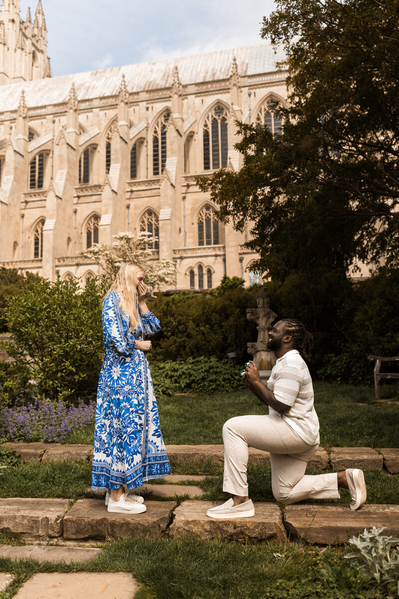 candid garden proposal moments at bishop's garden in front of the national cathedral in dc