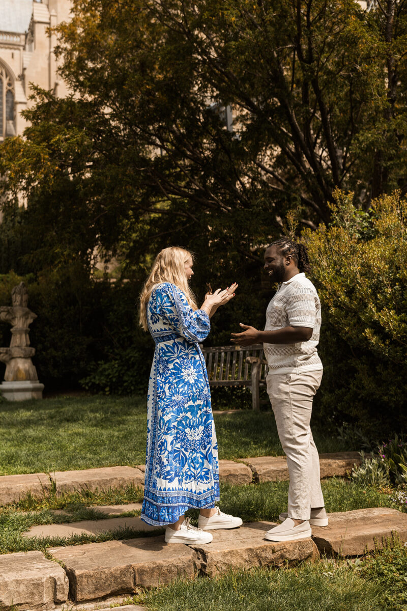 candid garden proposal moments at bishop's garden in front of the national cathedral in dc