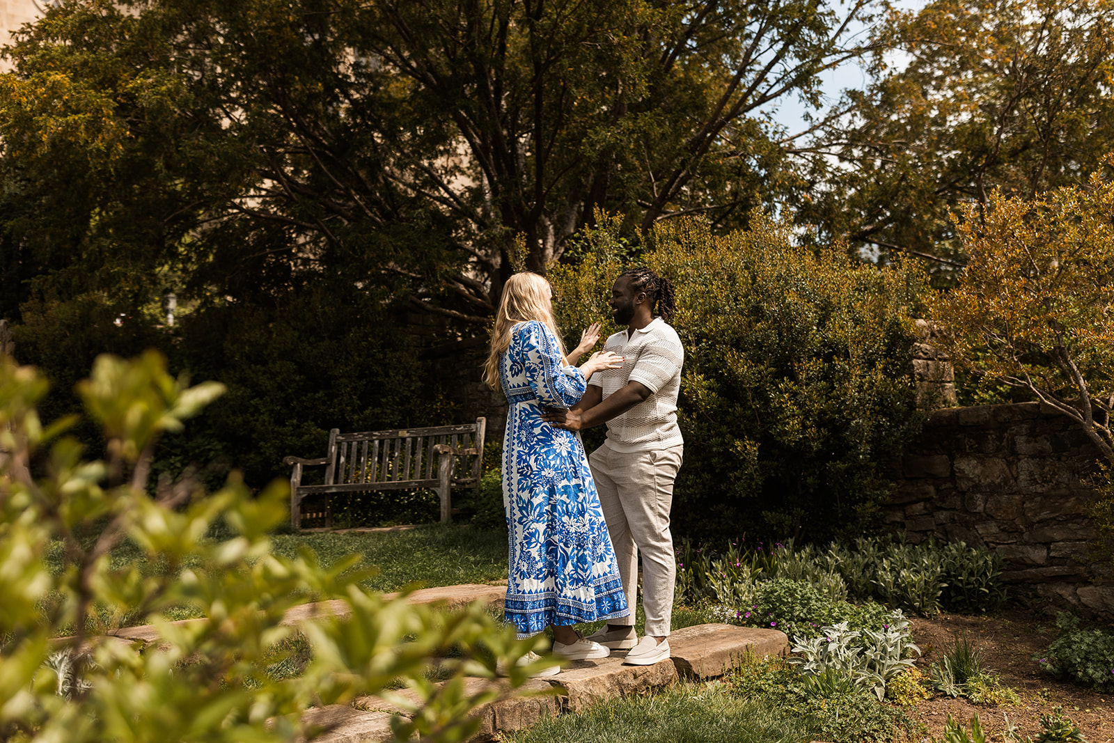 candid garden proposal moments at bishop's garden in front of the national cathedral in dc