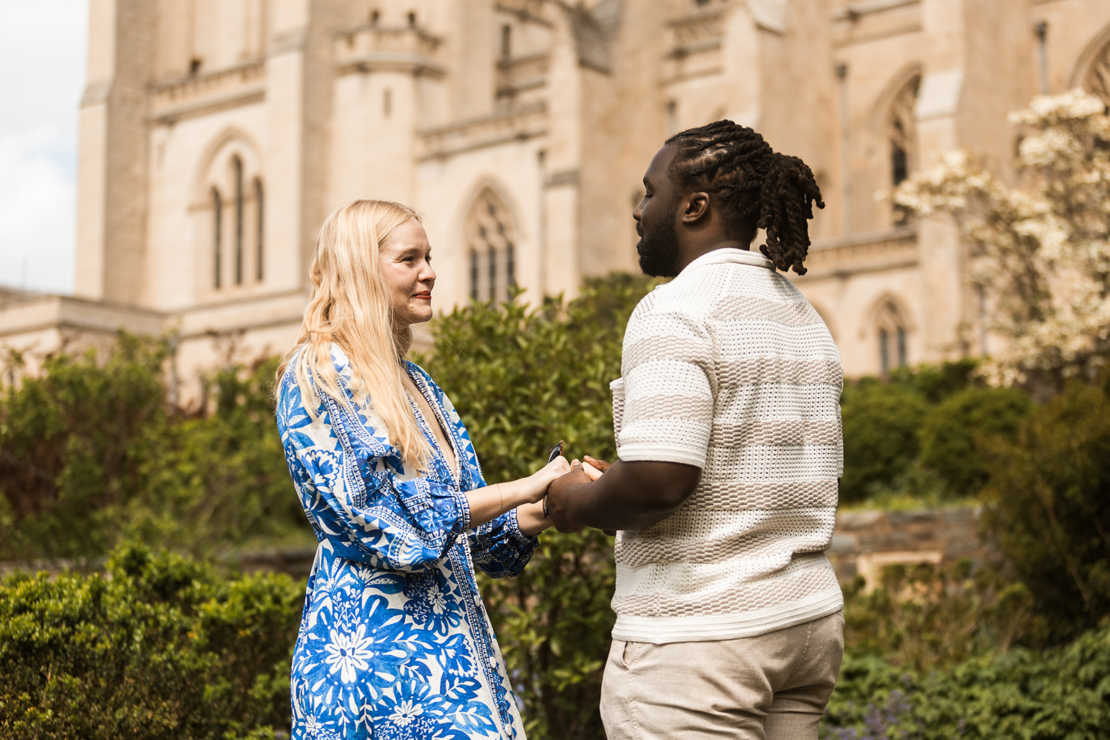 candid garden proposal moments at bishop's garden in front of the national cathedral in dc