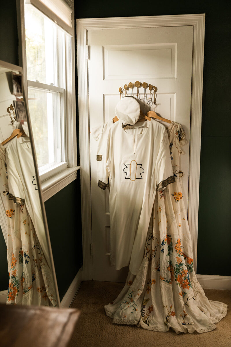wedding attire hanging from the closet