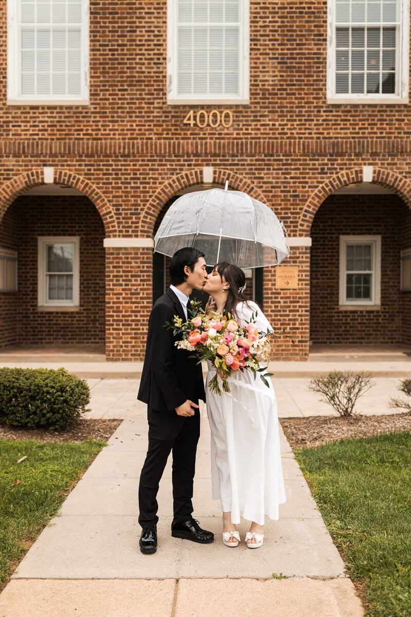bride and groom roaming around rainy old town fairfax