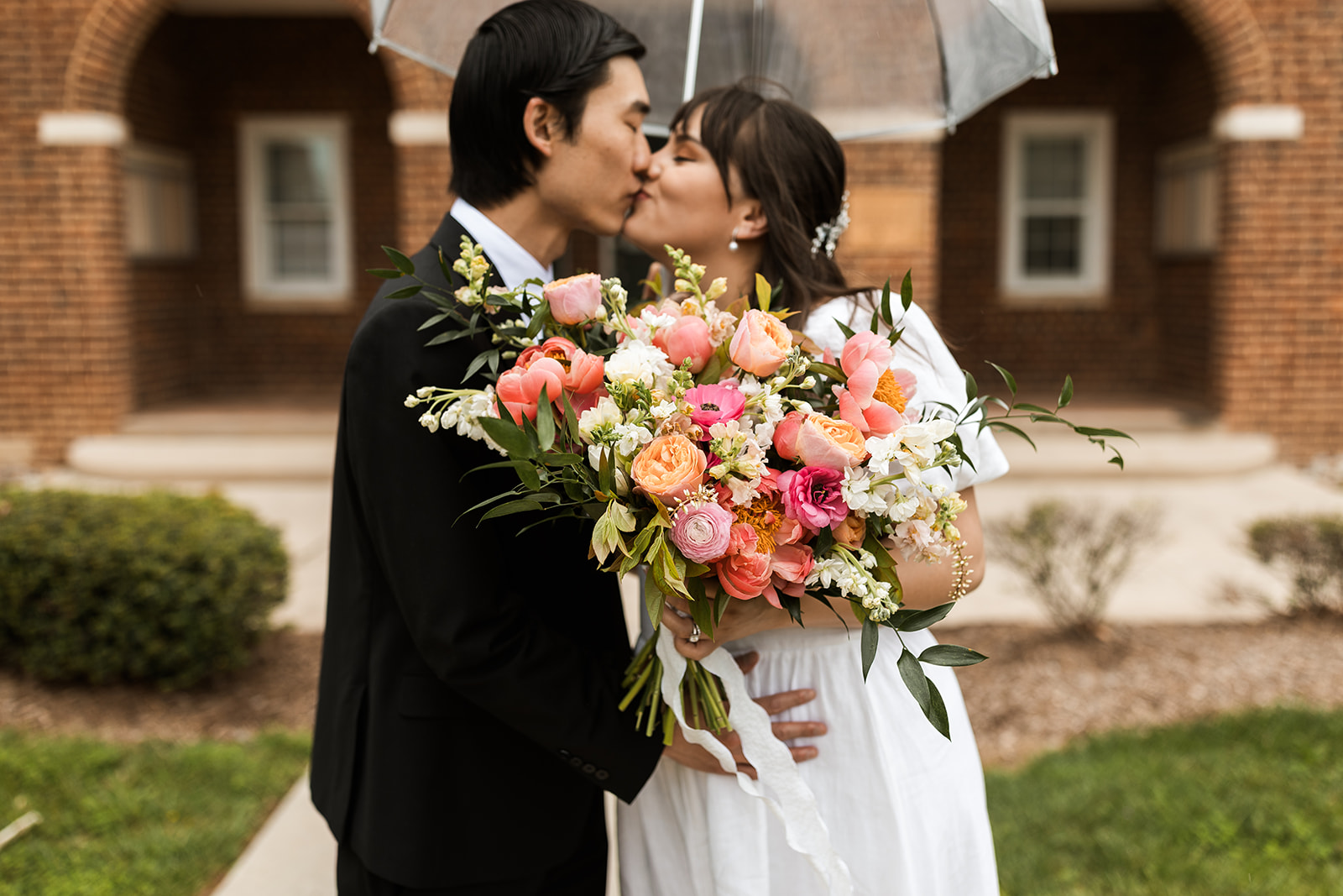bride and groom kissing in the heart of old town fairfax