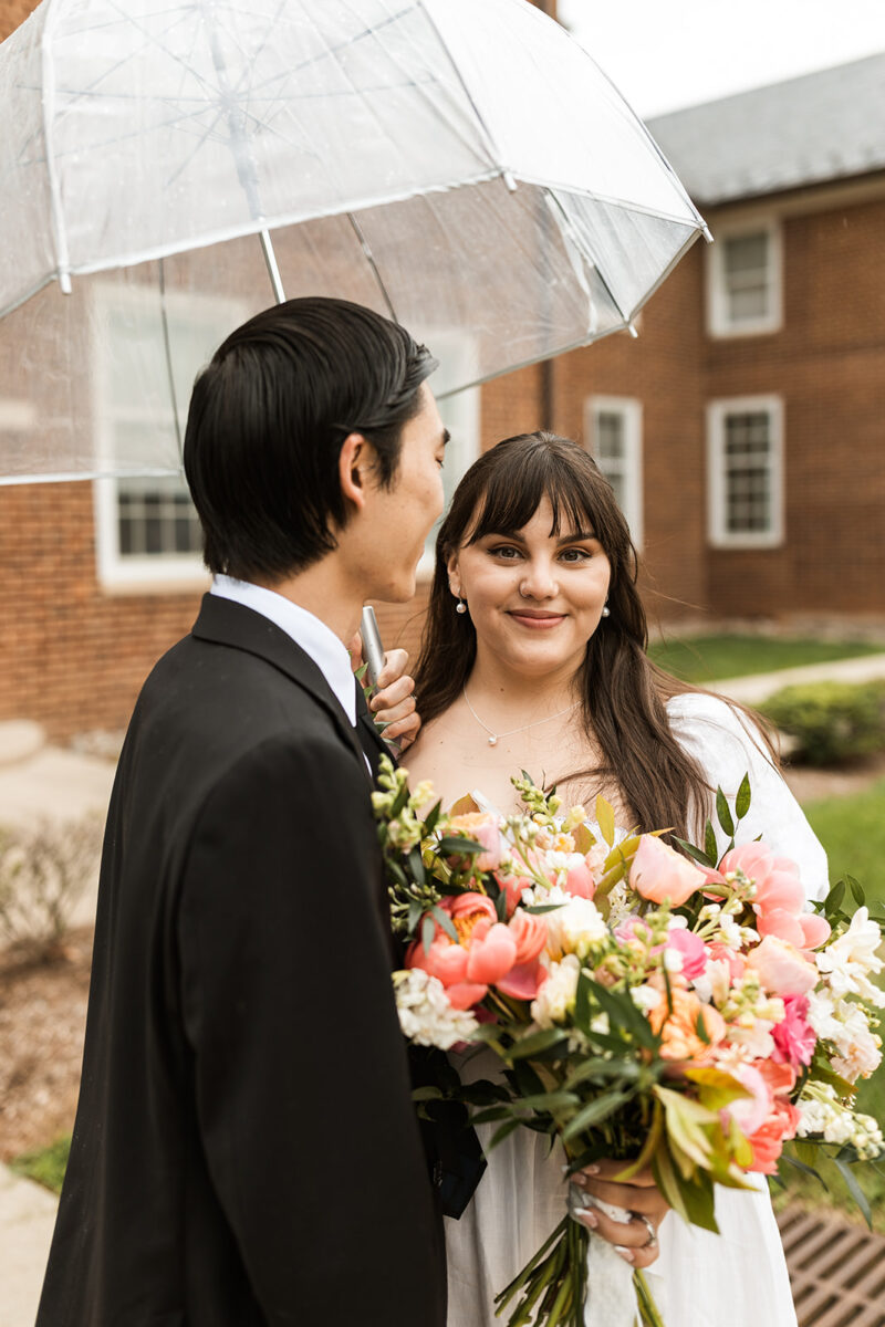 bride and groom roaming around rainy old town fairfax