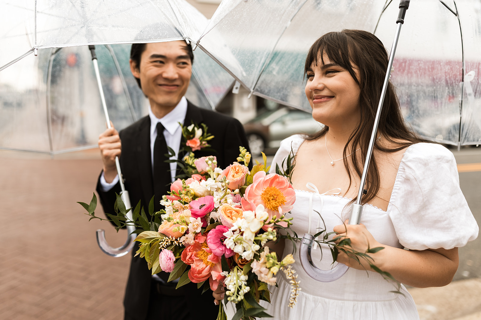 bride and groom roaming around rainy old town fairfax