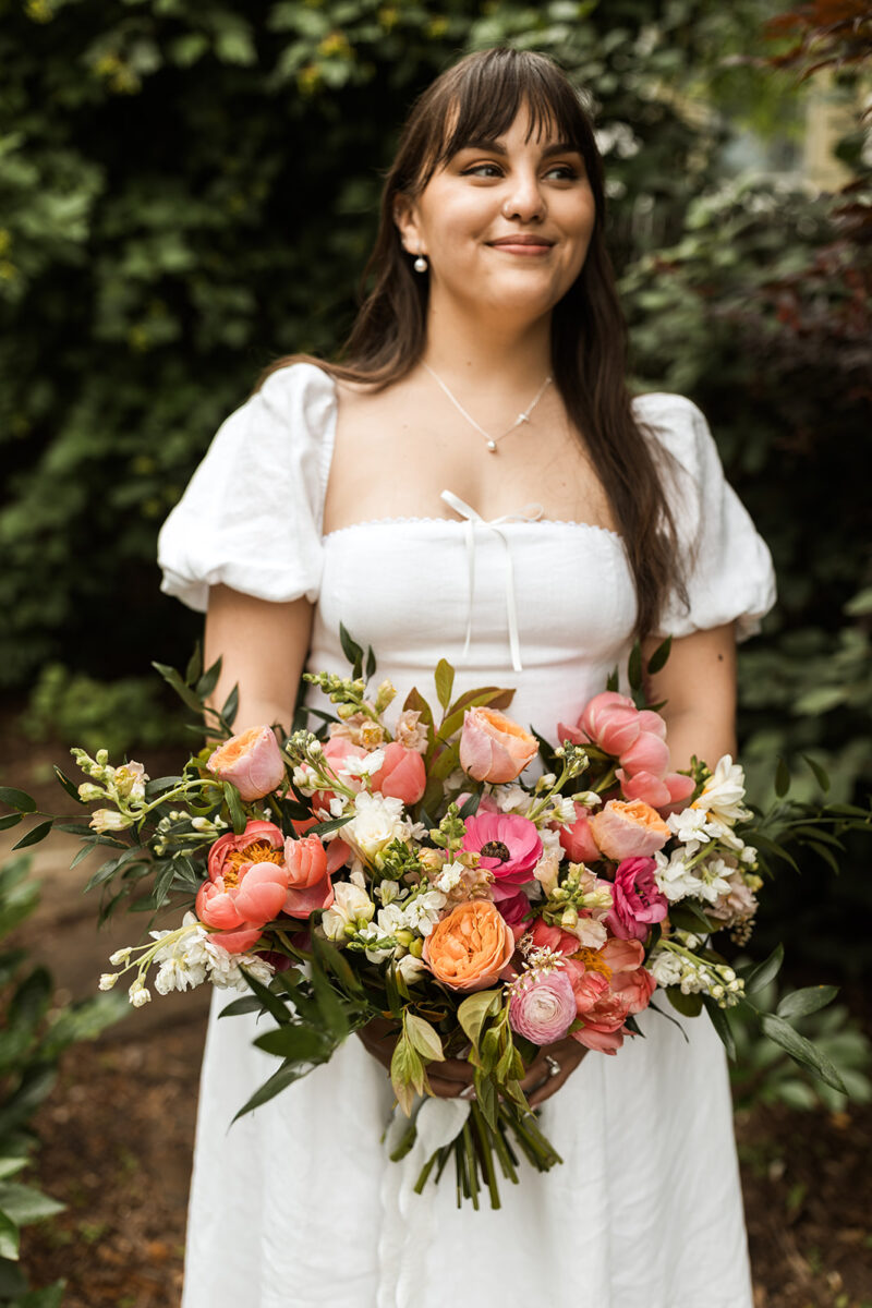 bridal portrait holding a colorful wedding bouquet